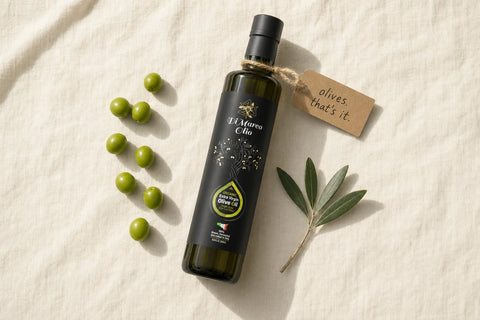 Di Marco Olio bottle with fresh olives and a kraft tag reading 'olives. that's it.'